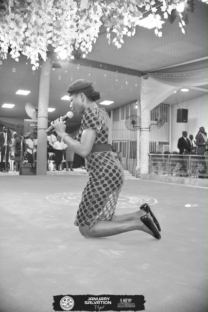 Woman kneeling in prayer
