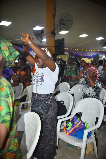 Woman Raising Hands in Praise